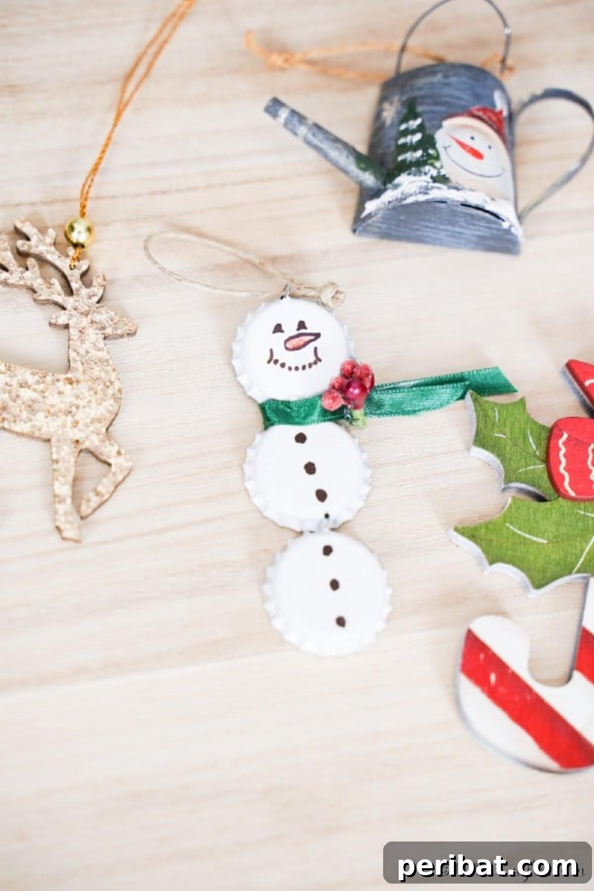 Upcycled Bottle Cap Snowman Charms 15 A bottle cap snowman ornament on a wooden table