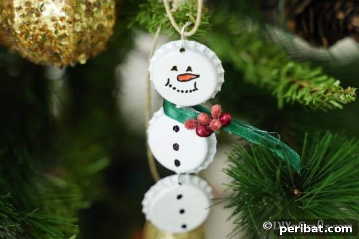 Upcycled Bottle Cap Snowman Charms 5 Snowman ornament hanging on a christmas tree