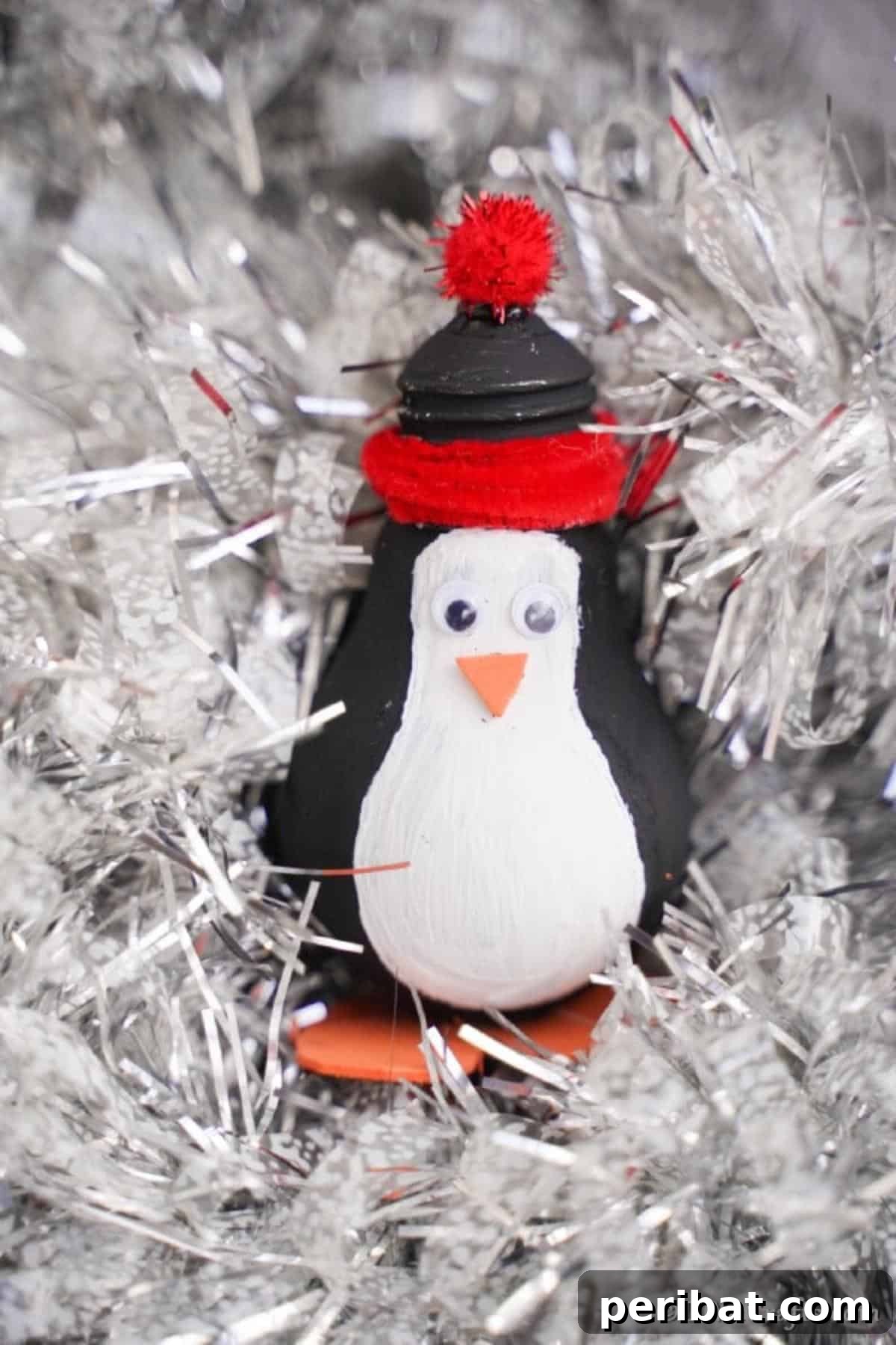 A penguin decoration in white Christmas tree