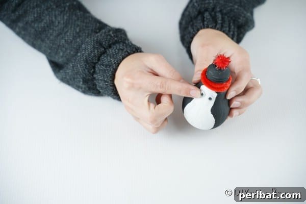 Adding eyes and nose to the penguin lightbulb