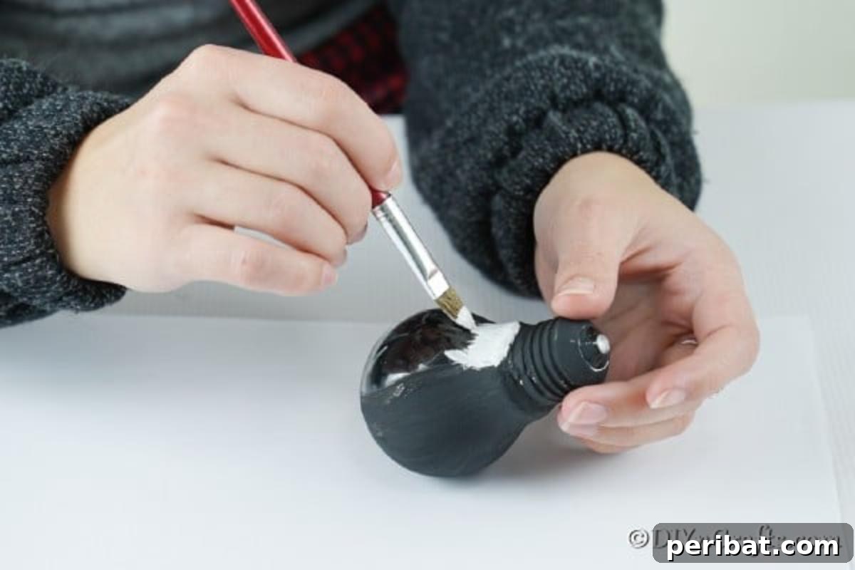 Painting a light bulb black