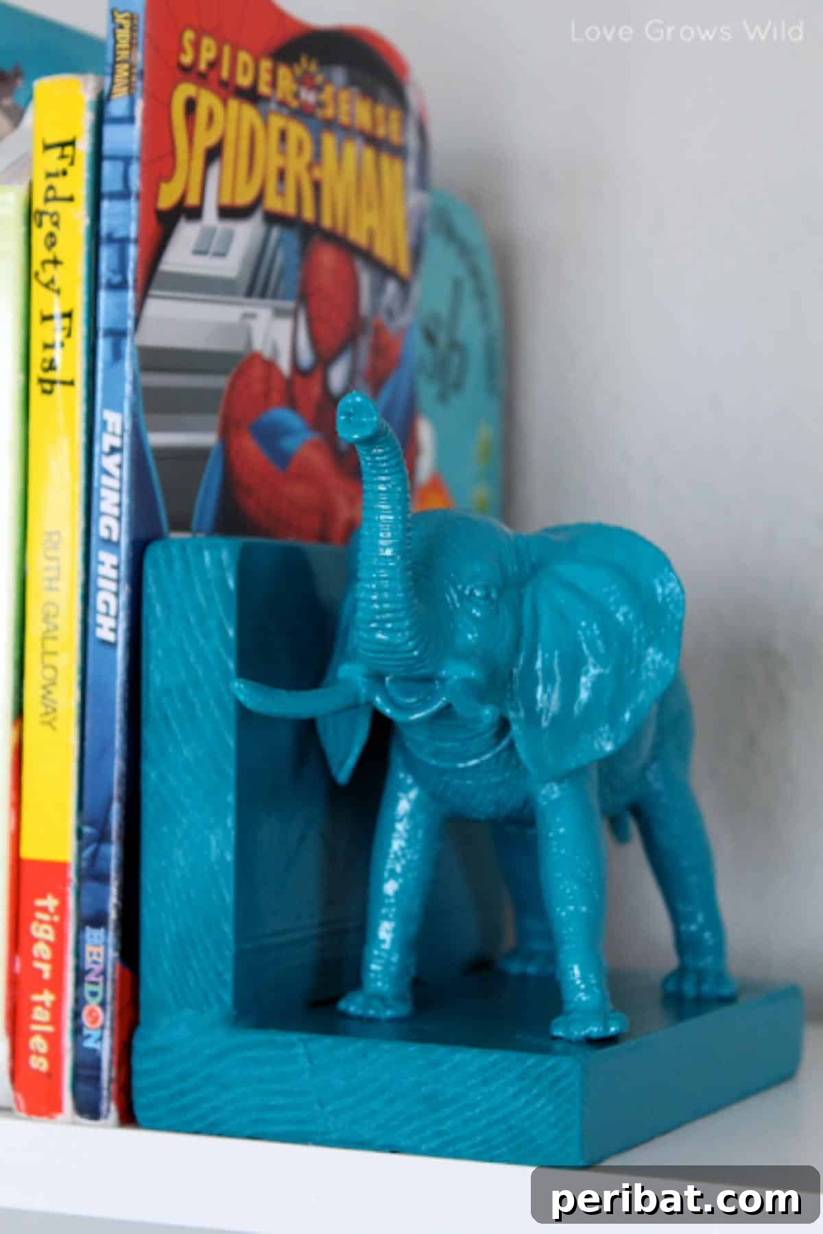 Elephant bookend crafted from a Dollar Store plastic animal and wooden block