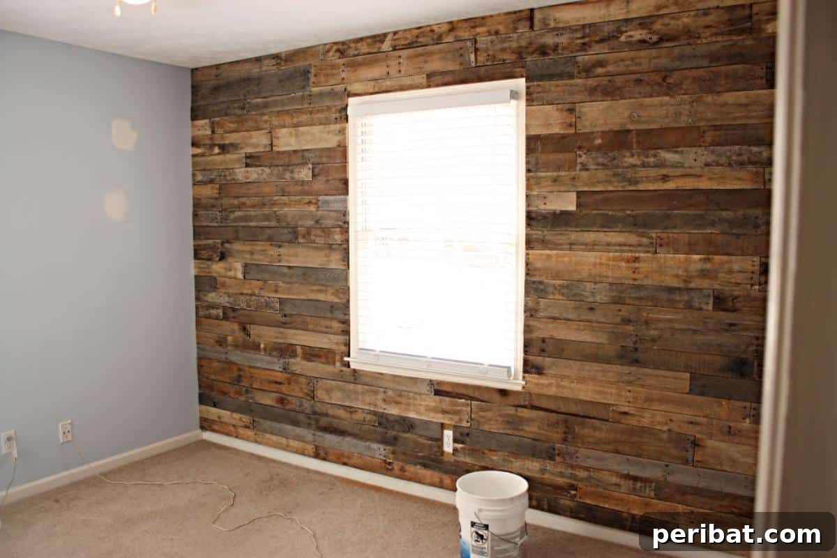 15 Ingenious DIY Wood Wall Designs to Elevate Your Space 12 Charming planked accent wall in a nursery room.