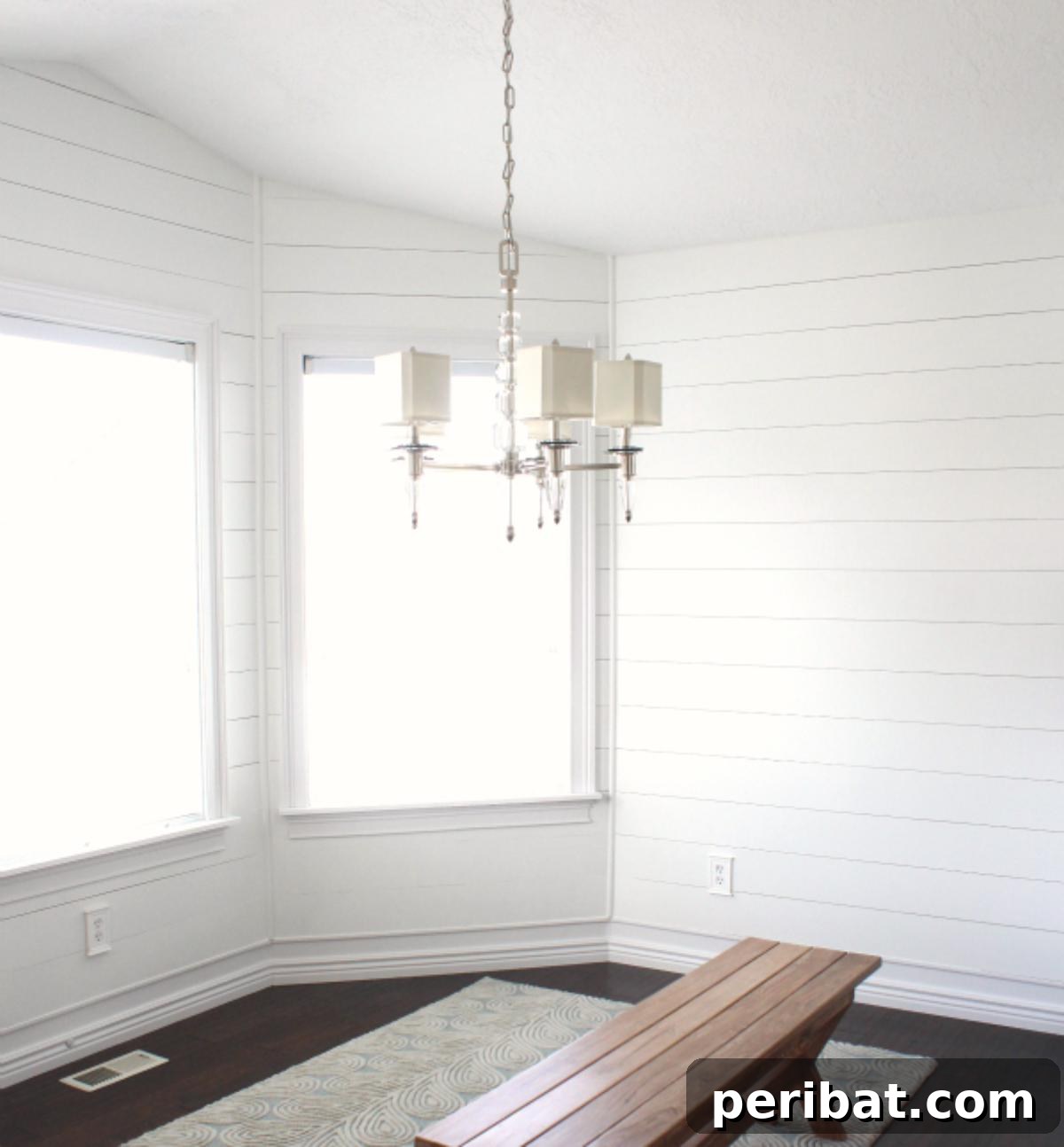 15 Ingenious DIY Wood Wall Designs to Elevate Your Space 15 Clean white plank wall in a kitchen or breakfast nook setting.