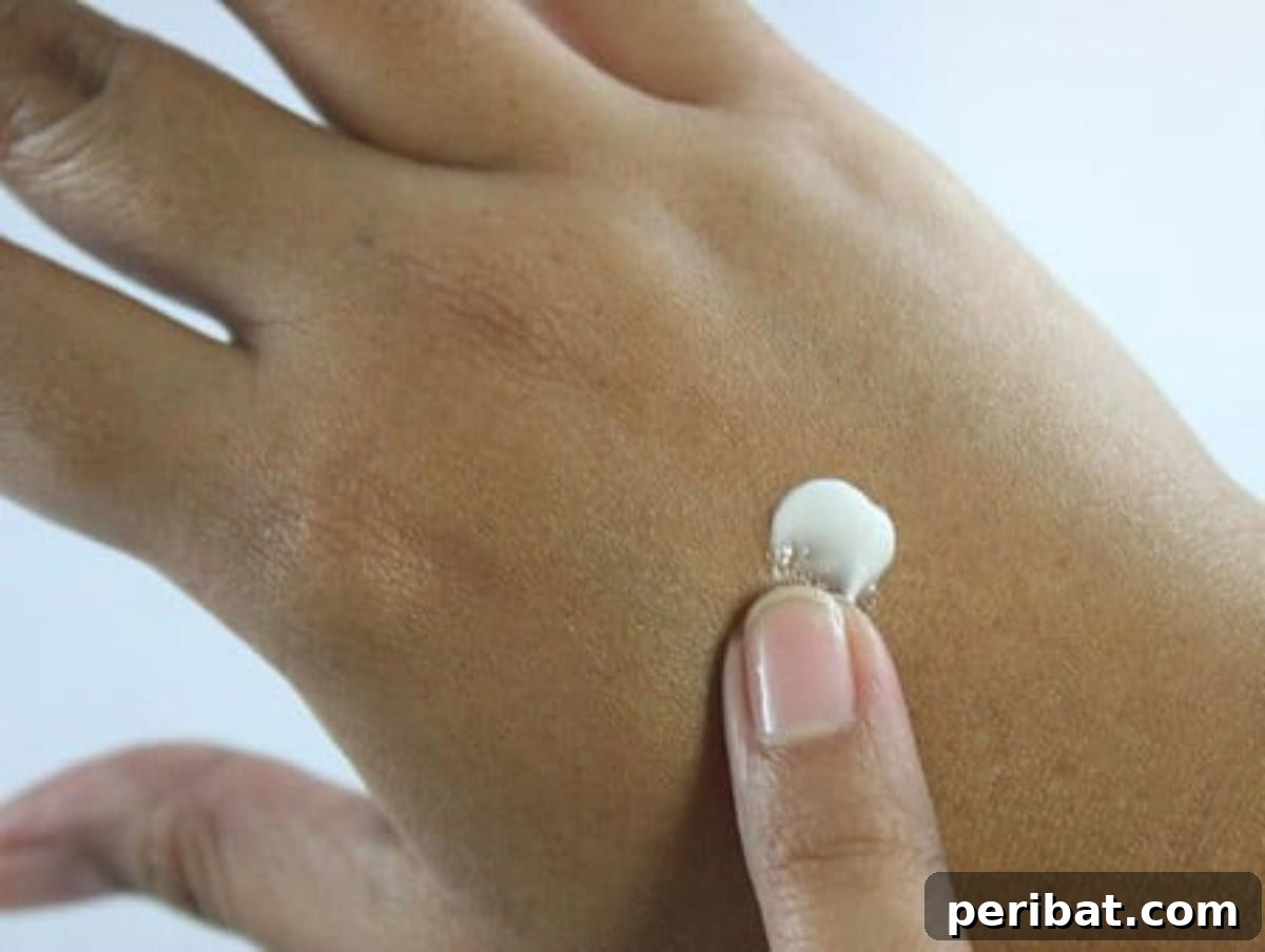 A drop of lotion on hand