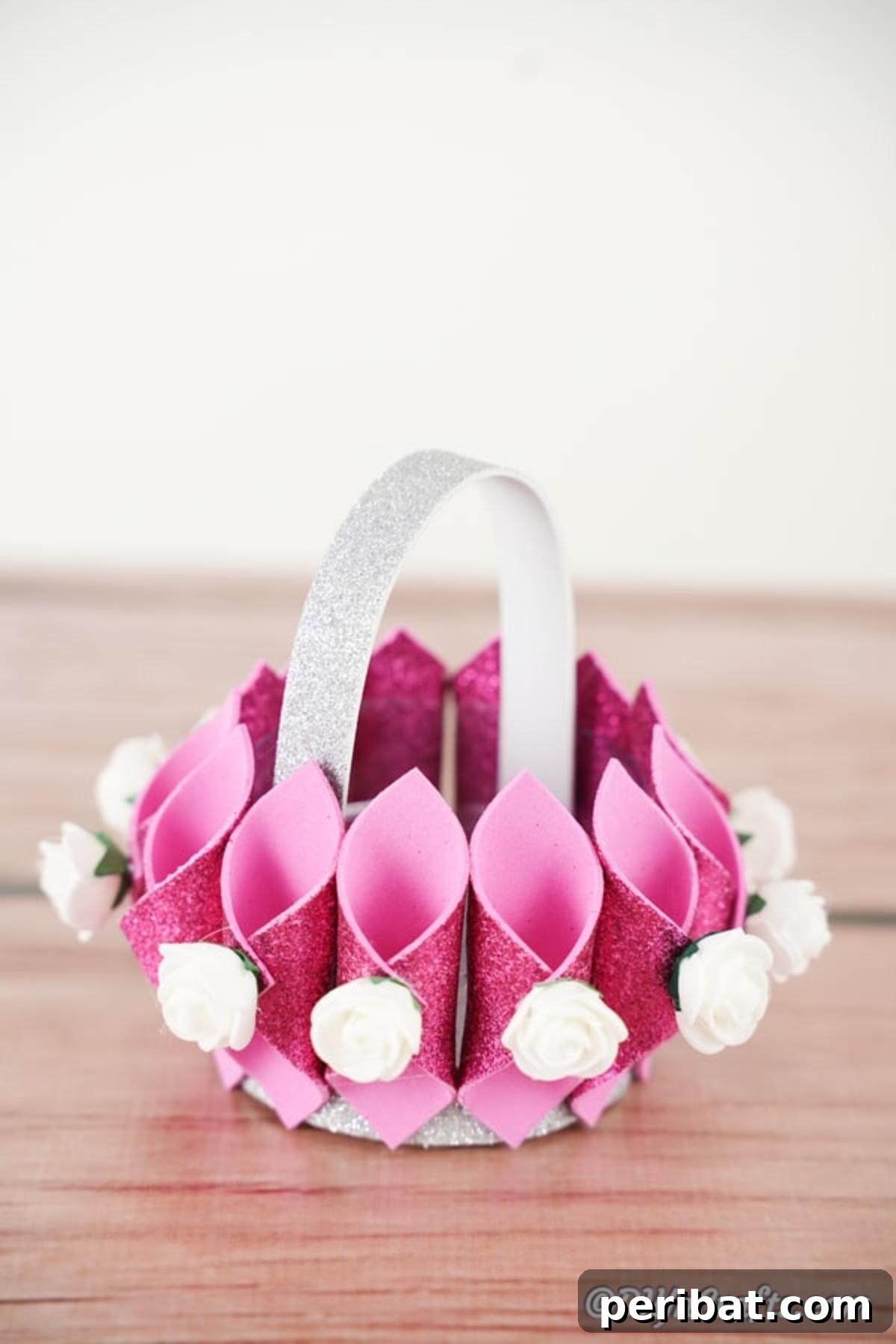 Shimmering Pink Paper Bloom Basket 21 Decorative pink glitter basket on wooden table, ready for display or use