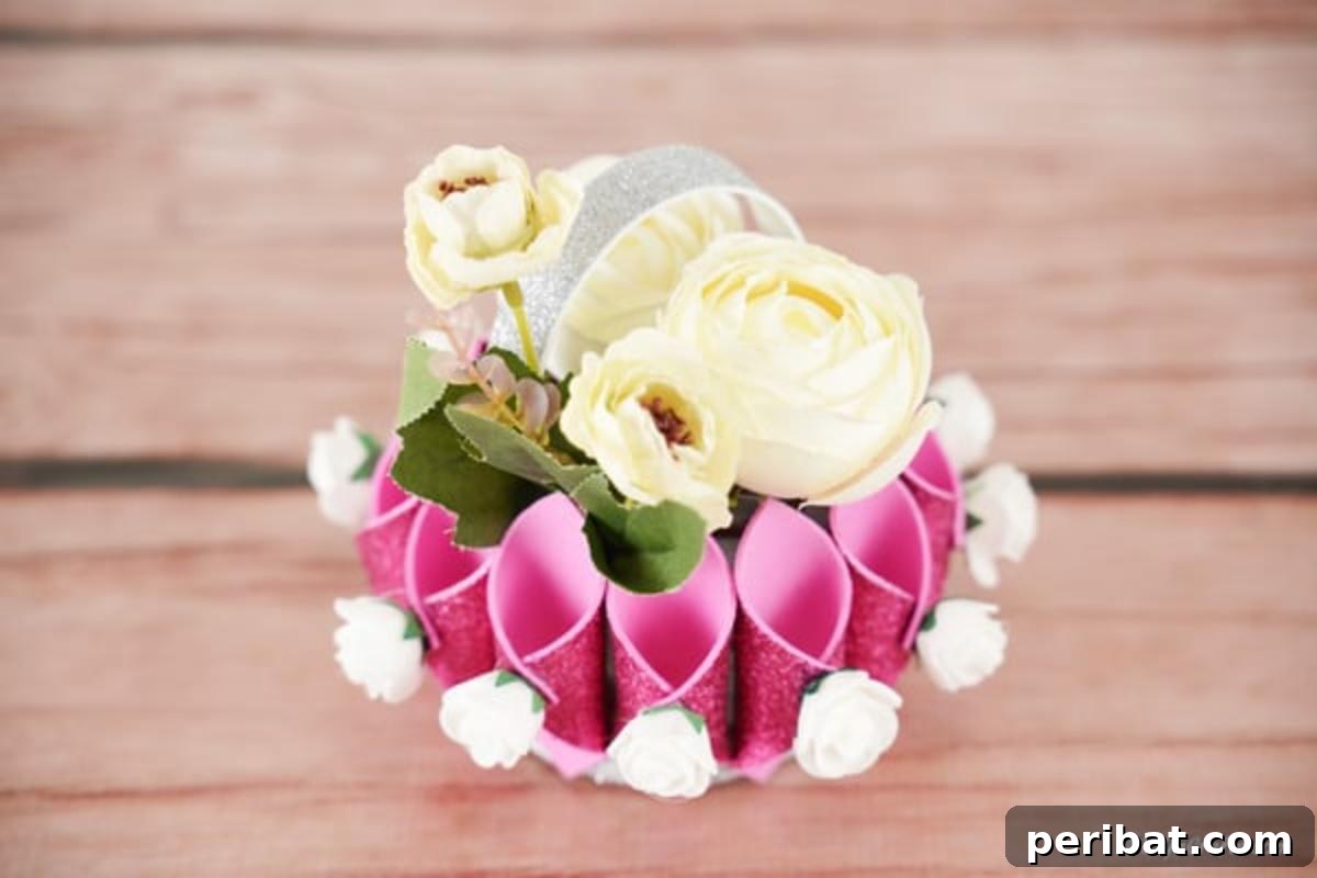 Shimmering Pink Paper Bloom Basket 4 Overhead picture of paper flower basket on wooden table, showcasing its elegant design and craftsmanship