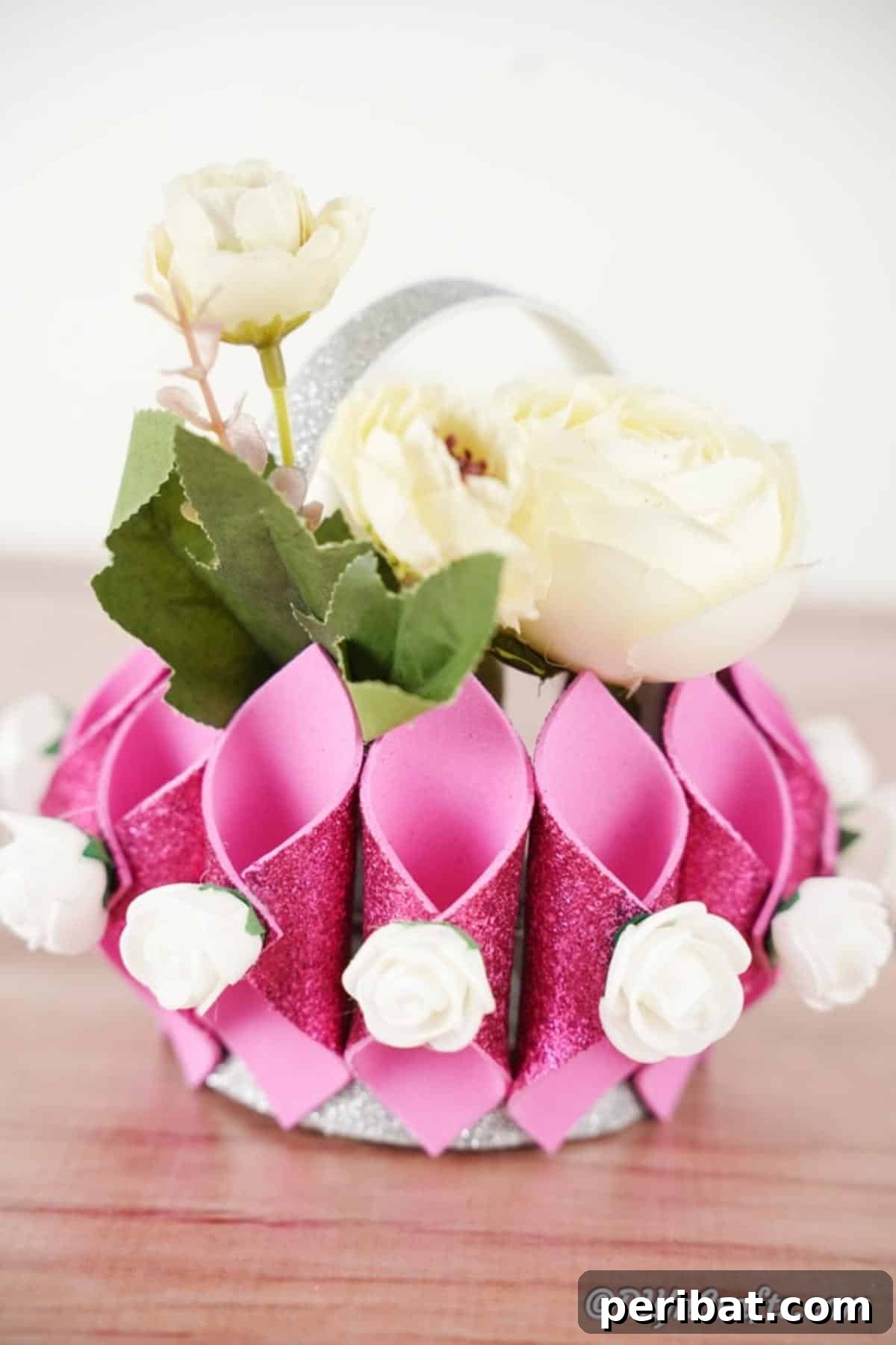 Shimmering Pink Paper Bloom Basket 6 Up close picture of decorative basket filled with white flowers, showing intricate details of the craft