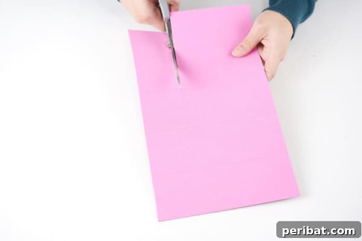 Shimmering Pink Paper Bloom Basket 9 Cutting strips of foam paper, demonstrating accurate scissor work