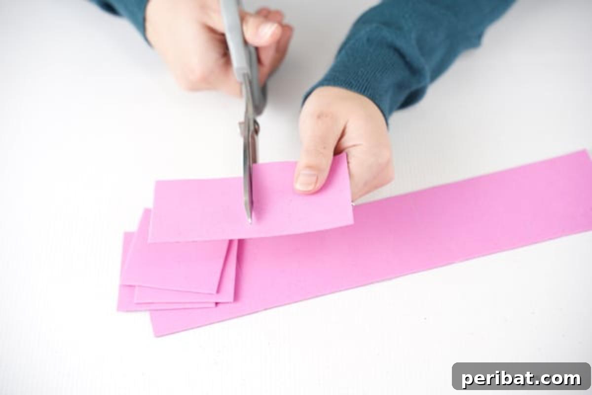 Shimmering Pink Paper Bloom Basket 10 Cutting foam paper into squares, ensuring consistent size for decorative elements