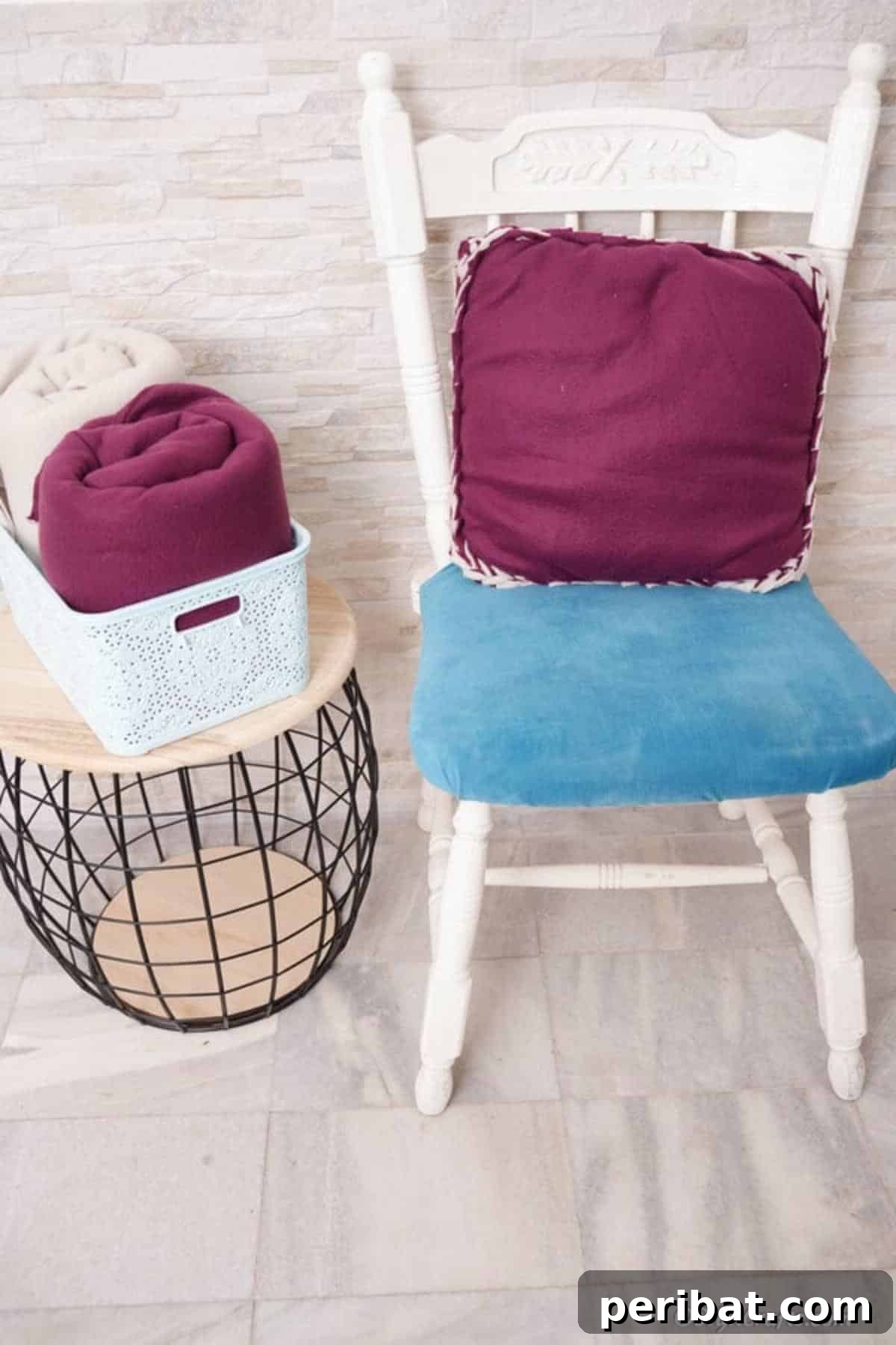 Easy 30-Minute No-Sew Reversible Fleece Pillow 4 A vibrant purple no-sew reversible pillow beautifully displayed on a pristine white chair.