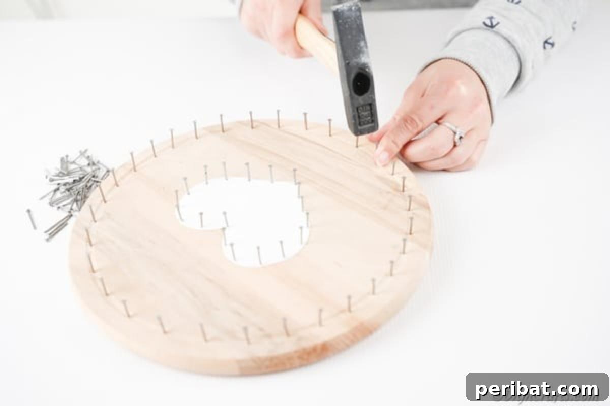 Heartfelt Valentine String Art Decoration 12 Adding nails to the outer rim of the round wooden board
