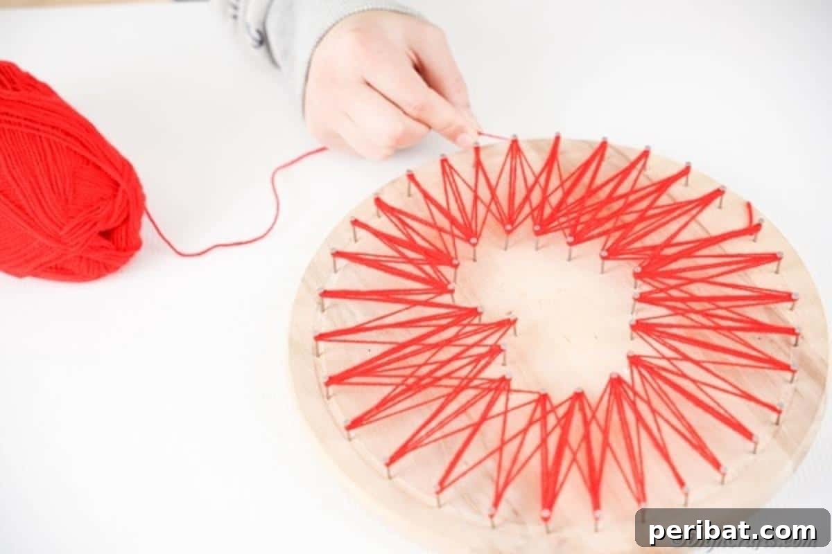 Heartfelt Valentine String Art Decoration 14 Wrapping string around nails for string art heart