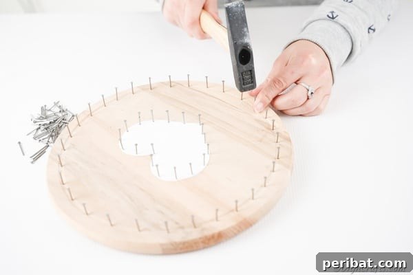 Heartfelt Valentine String Art Decoration 20 Adding nails to the outer rim of the round wooden board