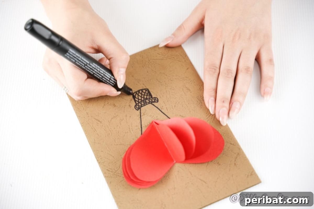Drawing a hot air balloon basket onto craft paper 3D card