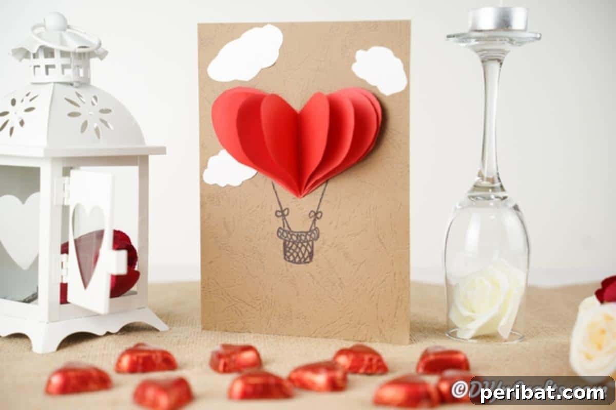 A 3D hot air balloon valentine's day card on table with heart candies