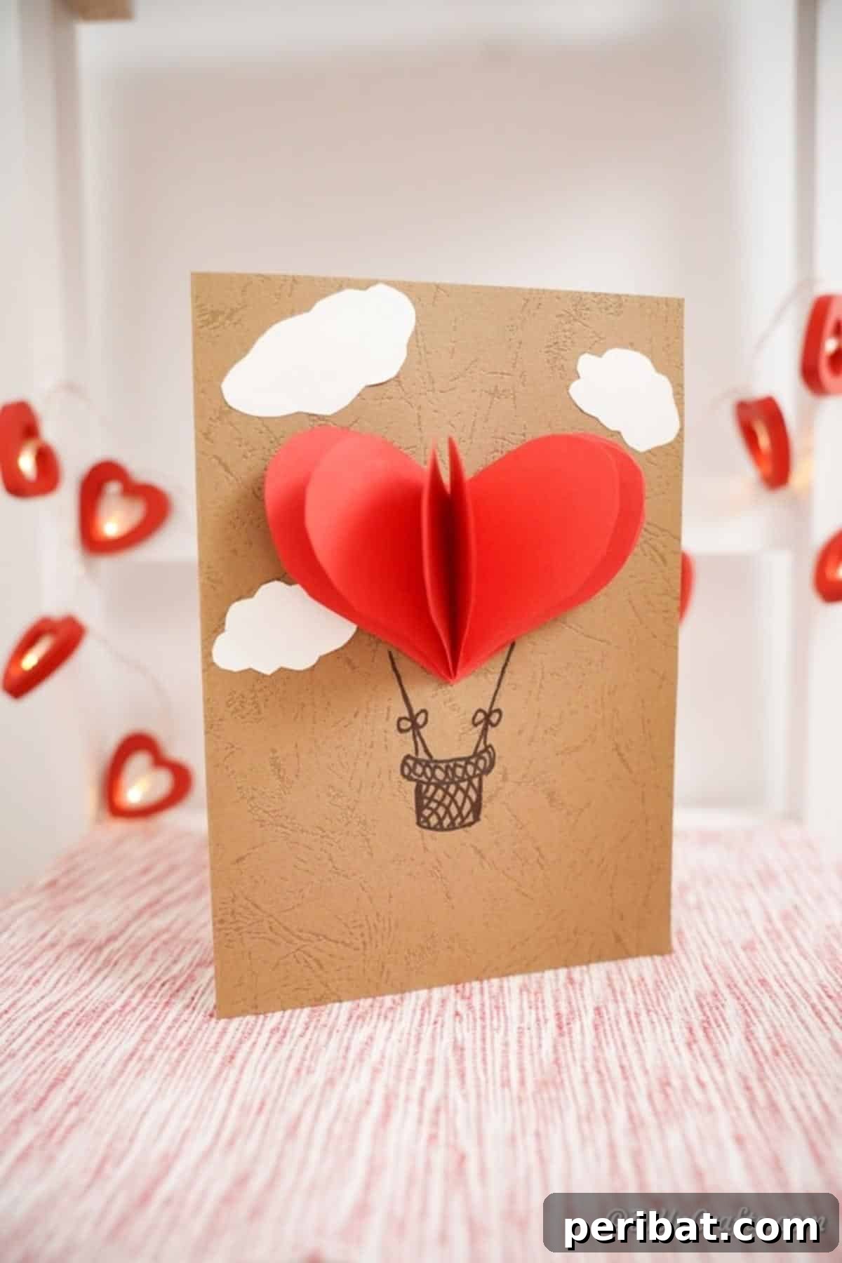 Hot air balloon card on pink shelf