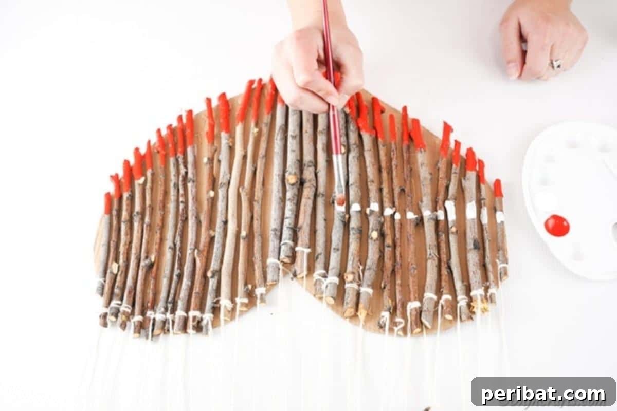 Hand-Painted Rustic Twig Heart Ornament 17 Painting a layer of red across the twig heart