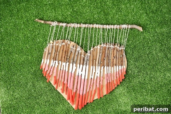 Wooden heart decoration on green grass