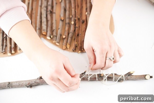 Hand-Painted Rustic Twig Heart Ornament 25 Tying twine to a stick above heart