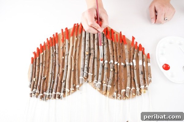 Hand-Painted Rustic Twig Heart Ornament 27 Painting a layer of red across the twig heart