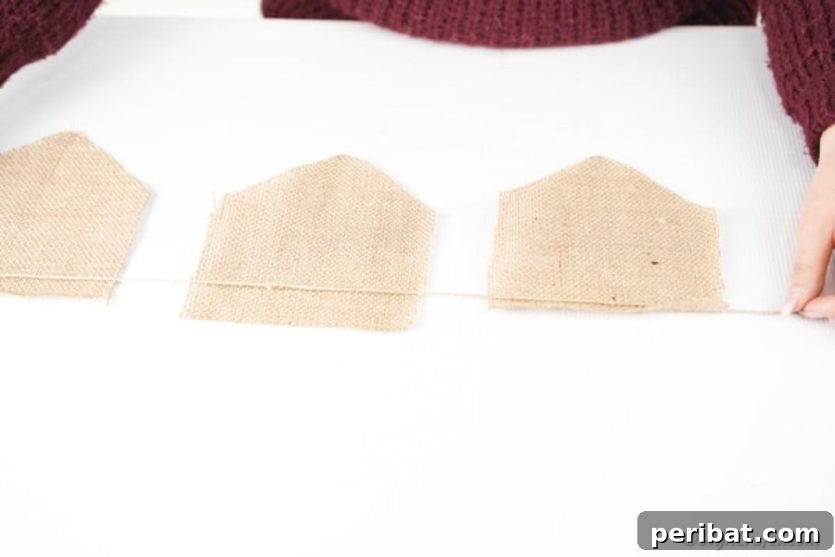 Rustic Love Burlap Heart Garland 13 Adding twine to back of burlap for garland