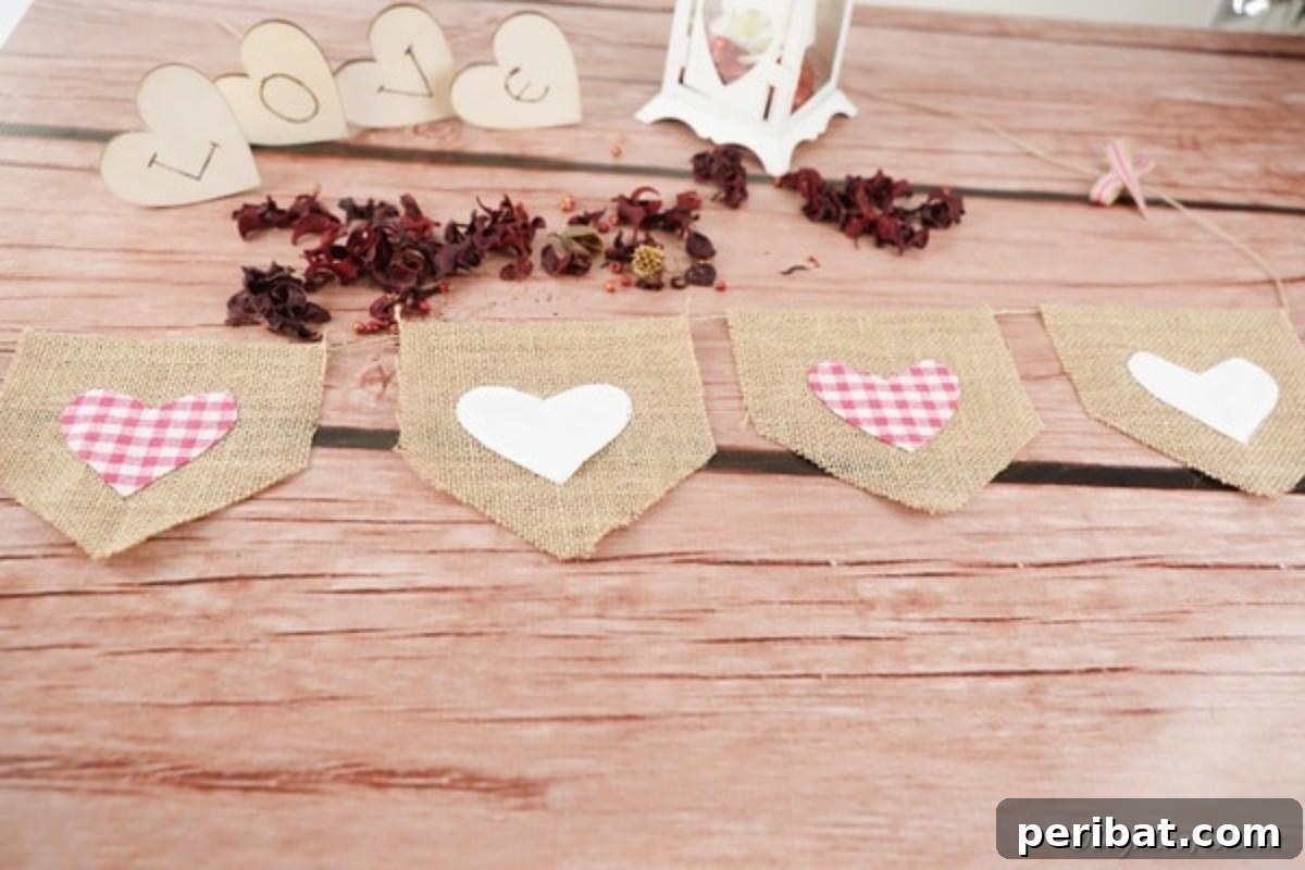 Rustic Love Burlap Heart Garland 4 Valentine burlap garland with red and pink hearts on wood table
