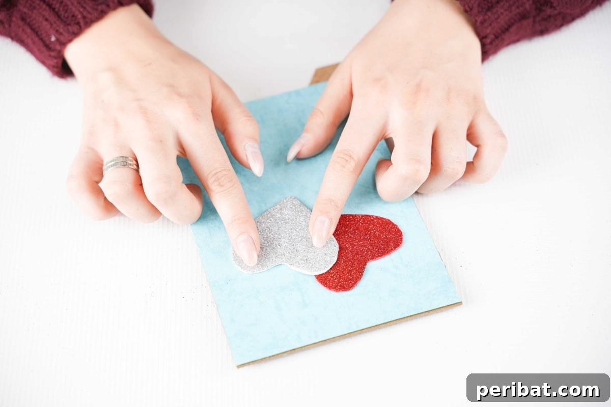 Dazzling Framed Hearts Valentine Decor 12 Adding hearts to front of blue paper