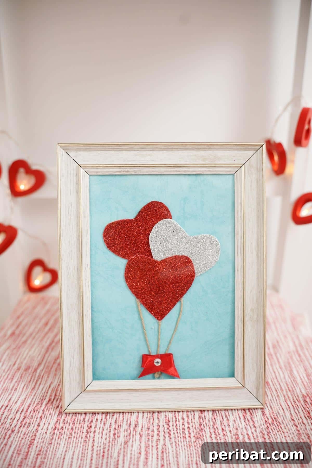 Dazzling Framed Hearts Valentine Decor 6 Framed hearts balloons on wooden surface with heart garland behind
