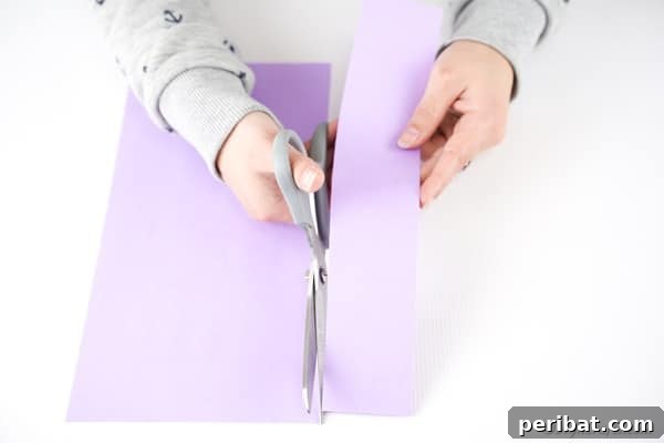 Cutting strip of paper out of page of paper