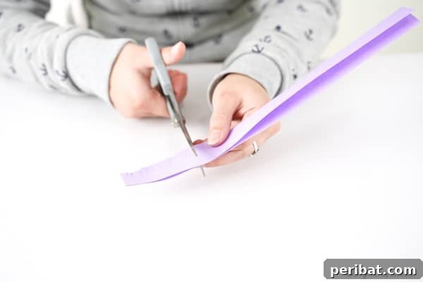 Cutting fringes on strip of paper