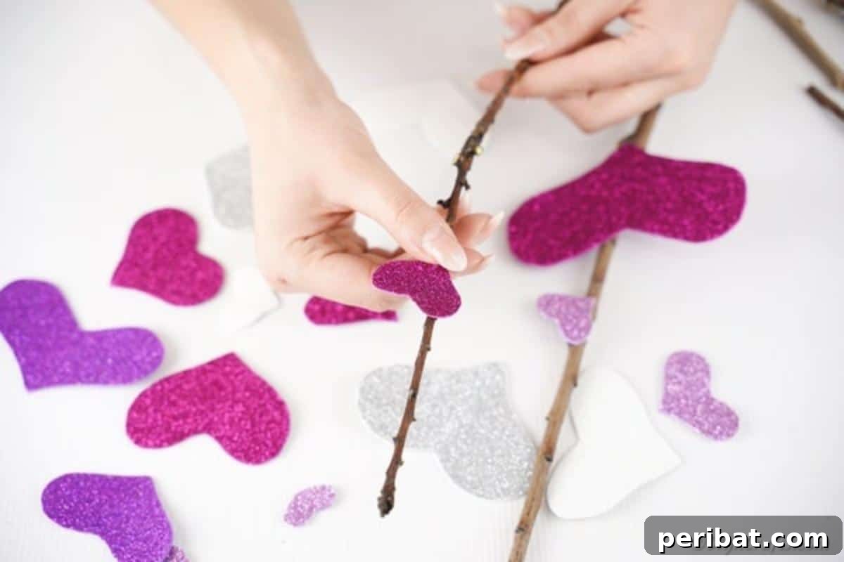 Attaching sticky hearts to branches