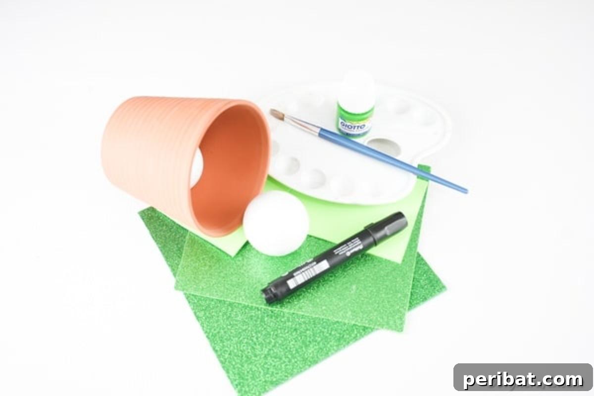 Whimsical Upcycled Flowerpot Frog Garden Art 7 Essential crafting supplies neatly arranged for creating a flower pot frog, including a terra cotta pot, green paint, foam paper, and various tools, set against a wooden background.