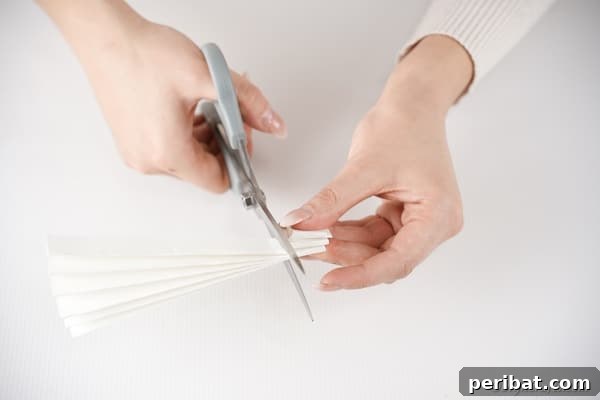 Little Hands, Loving Hearts: Kids' Valentine Paper Craft 20 Cutting white paper into arms and legs