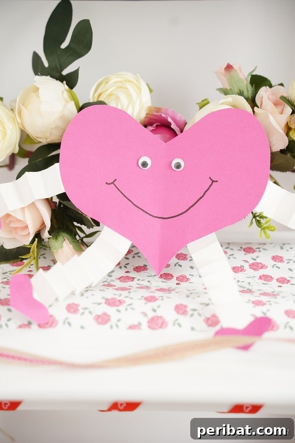 Little Hands, Loving Hearts: Kids' Valentine Paper Craft 25 Pink and white paper heart in front of white flowers