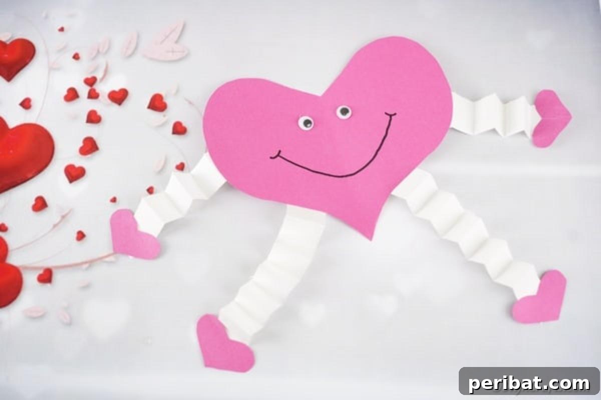 Little Hands, Loving Hearts: Kids' Valentine Paper Craft 6 Pink paper heart decoration placed on a surface with other heart-themed decor