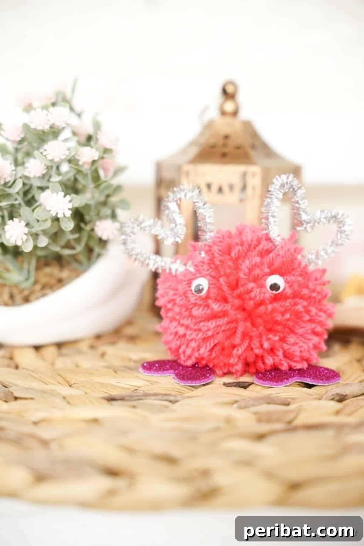 Valentine's day pom pom monster on woven mat