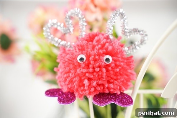 Valentine Monster Pom Pom in front of flowers