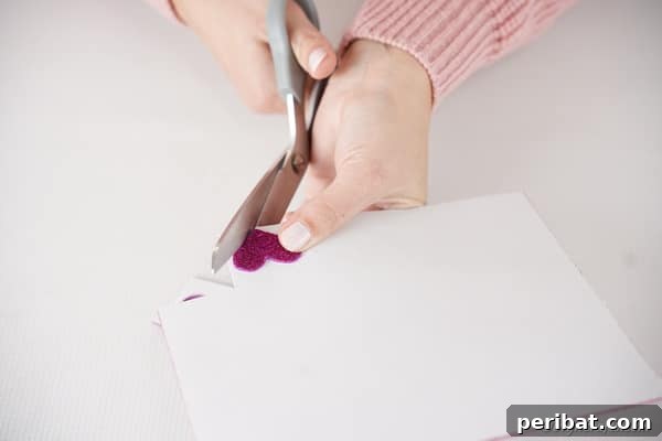Cutting out feet for pom pom monster