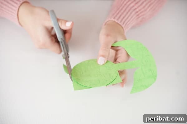 Craft Your Own Paper Flower Photo Keepsake 18 Cutting out the green flower shape from paper