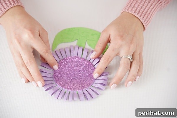 Craft Your Own Paper Flower Photo Keepsake 21 Placing the purple foam paper onto middle of paper flower