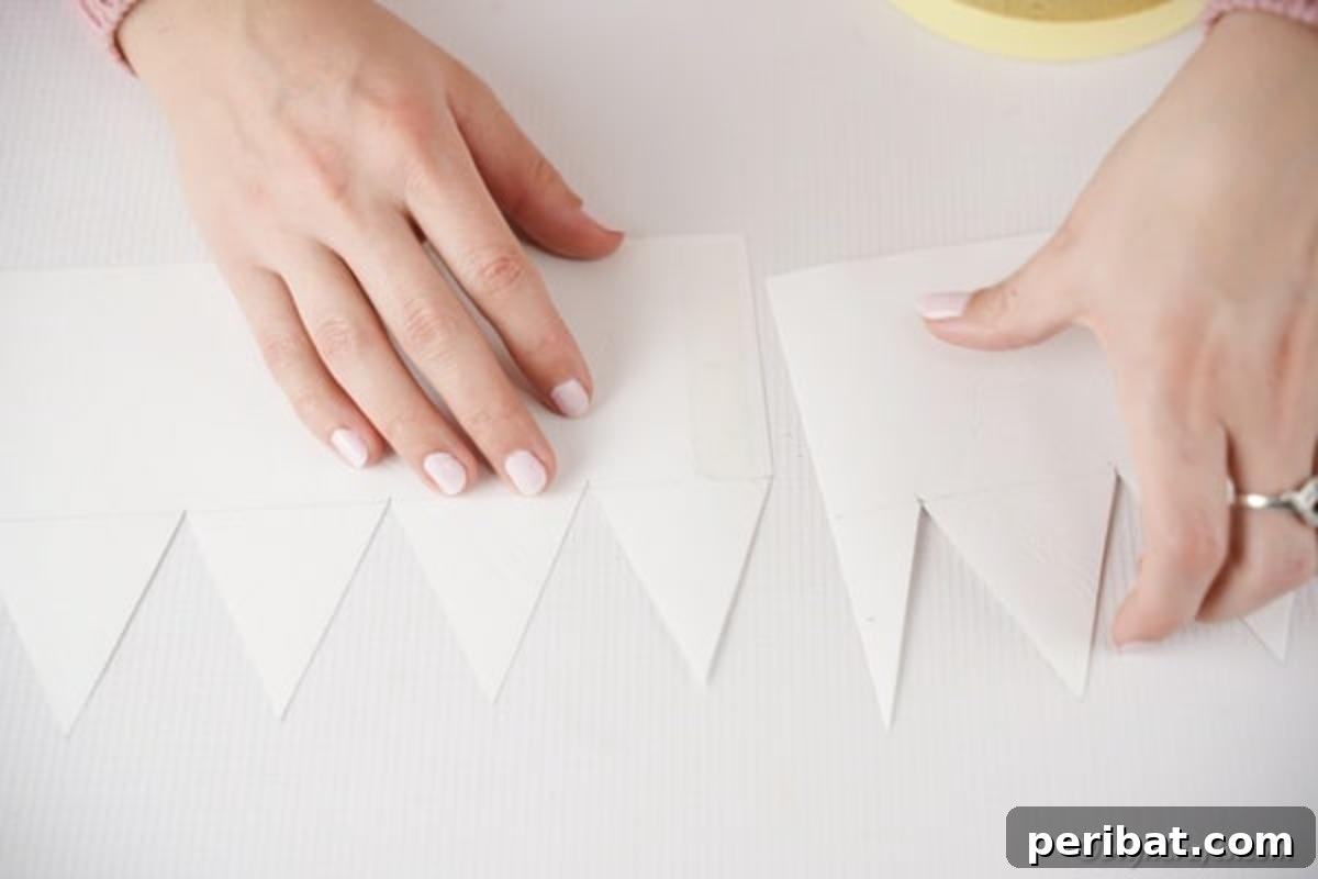 Easy Valentine Paper Crown Craft for Children 10 The ends of a paper crown are brought together and fastened, demonstrating how to form the circular shape of the crown.