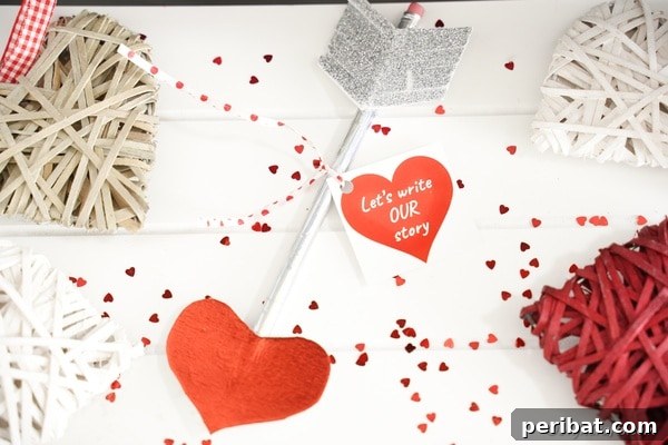 Beautifully arranged Valentine Cupid's arrow pencil on heart-patterned paper for a craft card