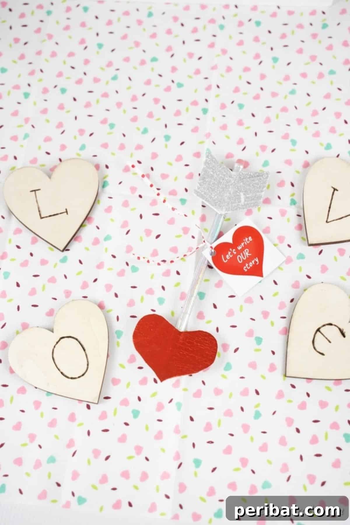 Make Your Own Valentine's Love Arrows 4 A charming Valentine pencil surrounded by tiny red hearts on a pristine white surface