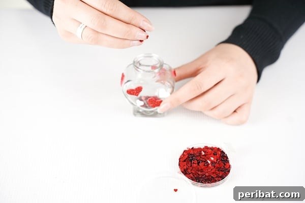 Pouring confetti into jar for message in a bottle