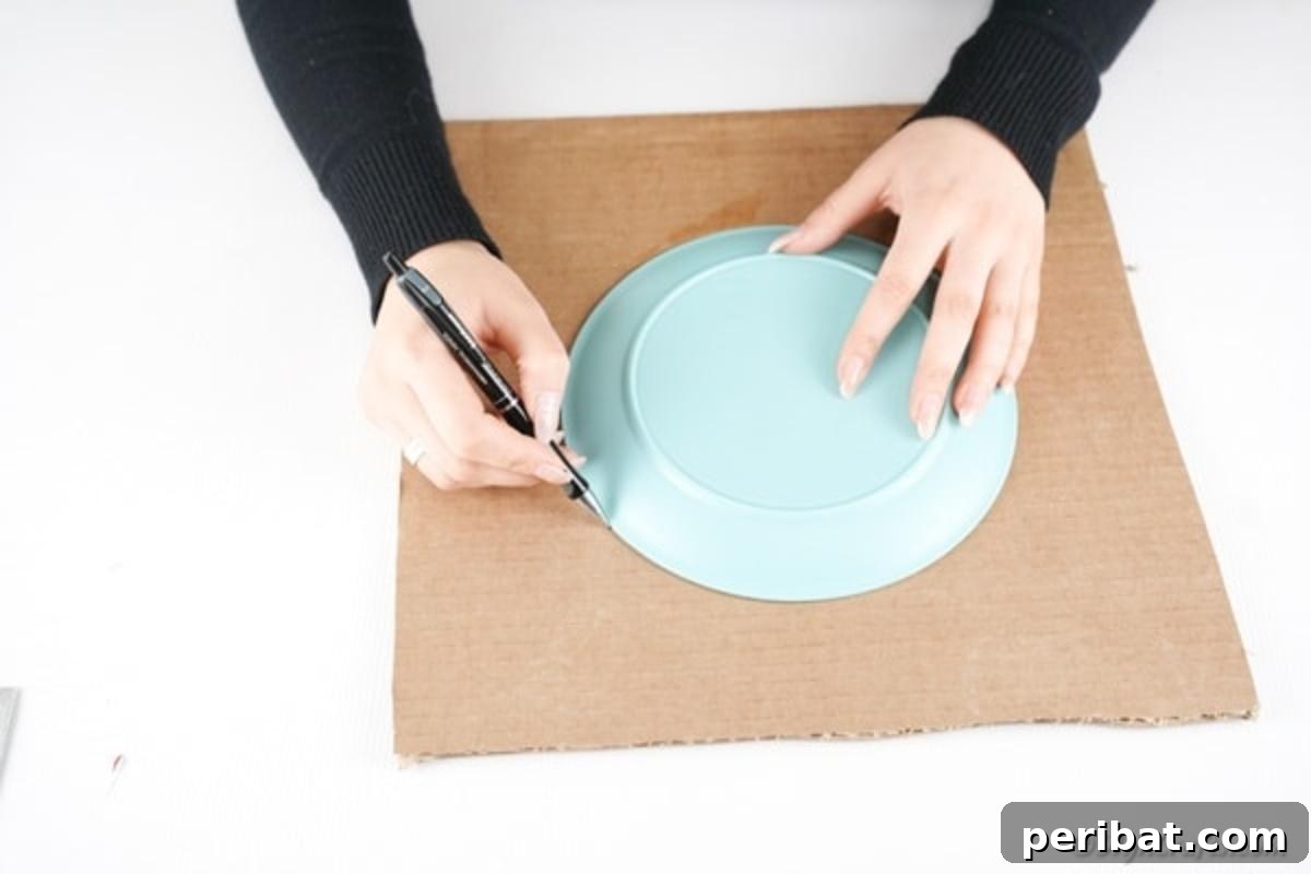 Tracing a circle onto cardboard
