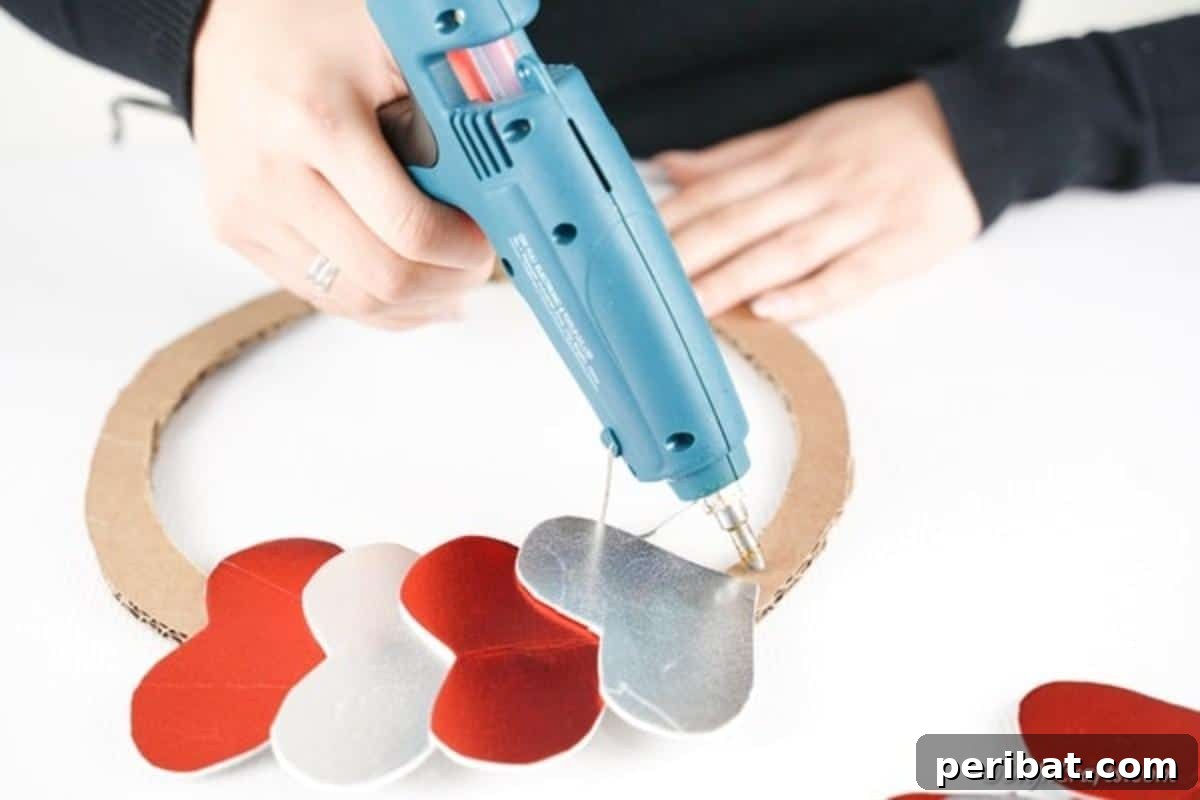 Gluing glitter hearts in place