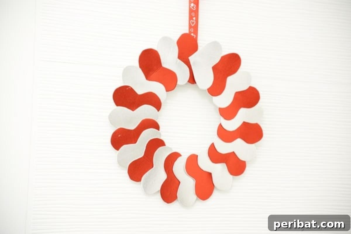 Valentine's day heart wreath against white wall