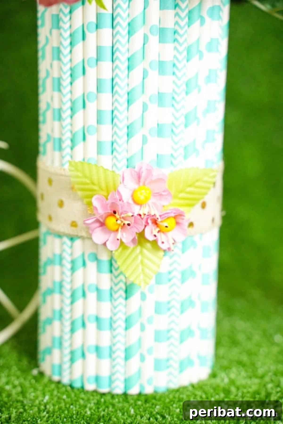 Handmade Straw-Embellished Mason Jar Vase 7 Close-up view of a vibrant orange flower in a straw-decorated mason jar vase