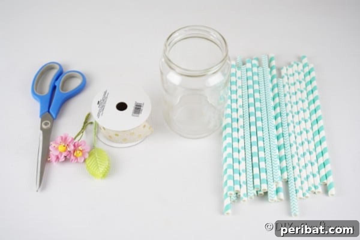 Handmade Straw-Embellished Mason Jar Vase 8 Collection of supplies for crafting a mason jar vase, including jar, straws, ribbon, and glue